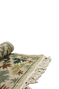 Tapis beige motifs verts
